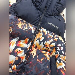 Columbia puffy vest. Navy blue with flower print. Size M. New without tags.